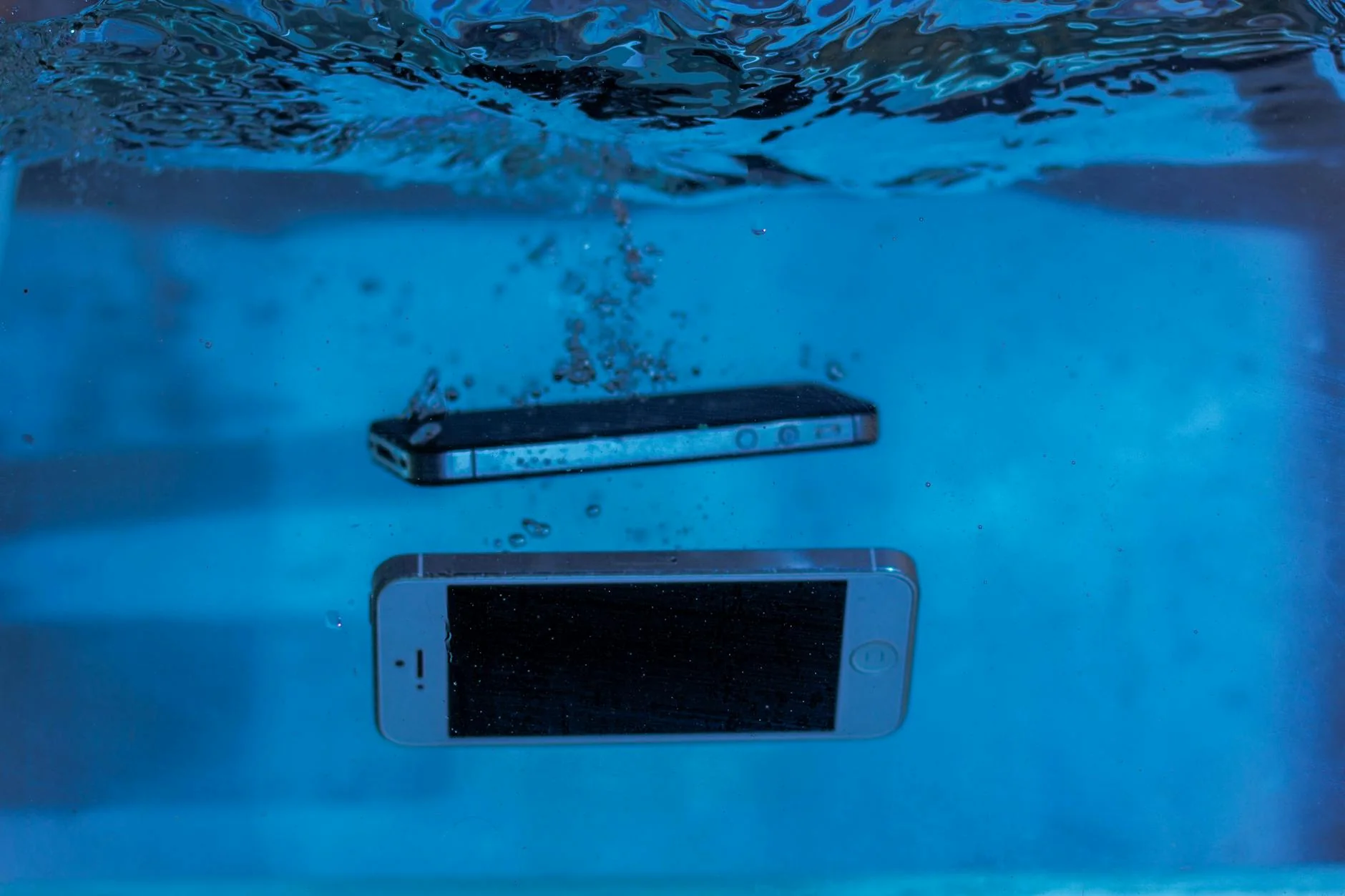 Specialist restoring liquid-damaged electronics illustrative graphic